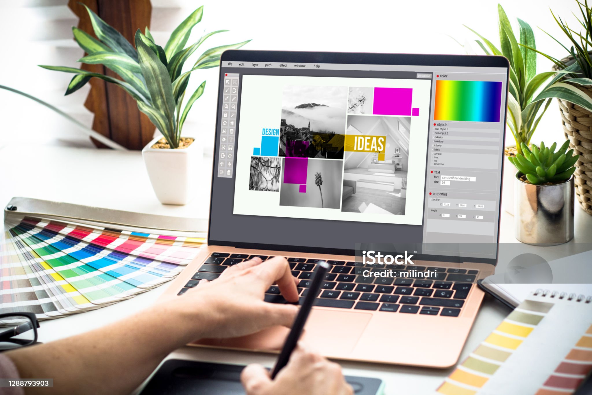 Person designing a website on a laptop