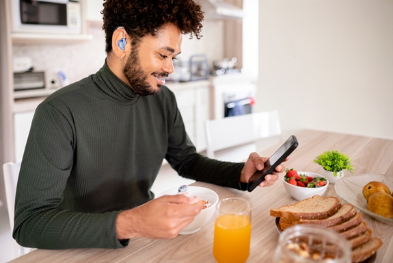 Hearing impaired man using his phone