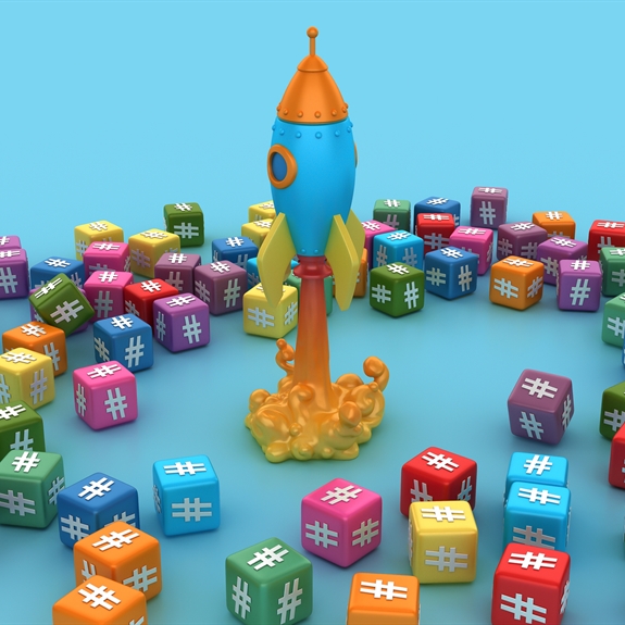 Blocks showing hashtags with a rocket in the centre of the image
