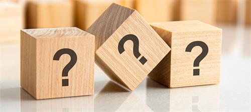 Wooden blocks with question marks